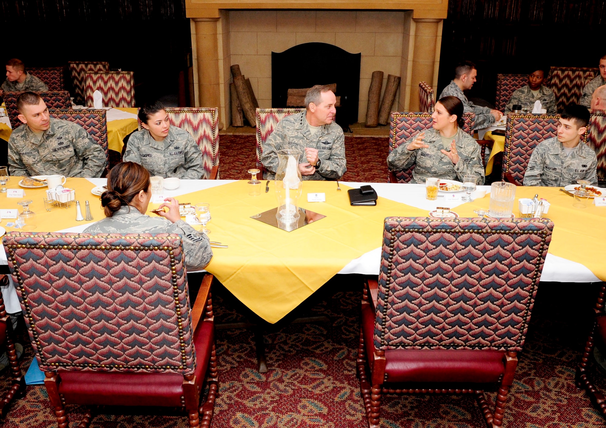 RAF MILDENHALL, England -- Gen. Mark A. Welsh III, U.S. Air Forces in Europe commander, talks with Airmen during breakfast at the Gateway Dining Facility March 3, 2011. The Airmen that dined with General Welsh were selected to represent Team Mildenhall as exemplary Airmen. (U.S. Air Force photo/Senior Airman Ethan Morgan)