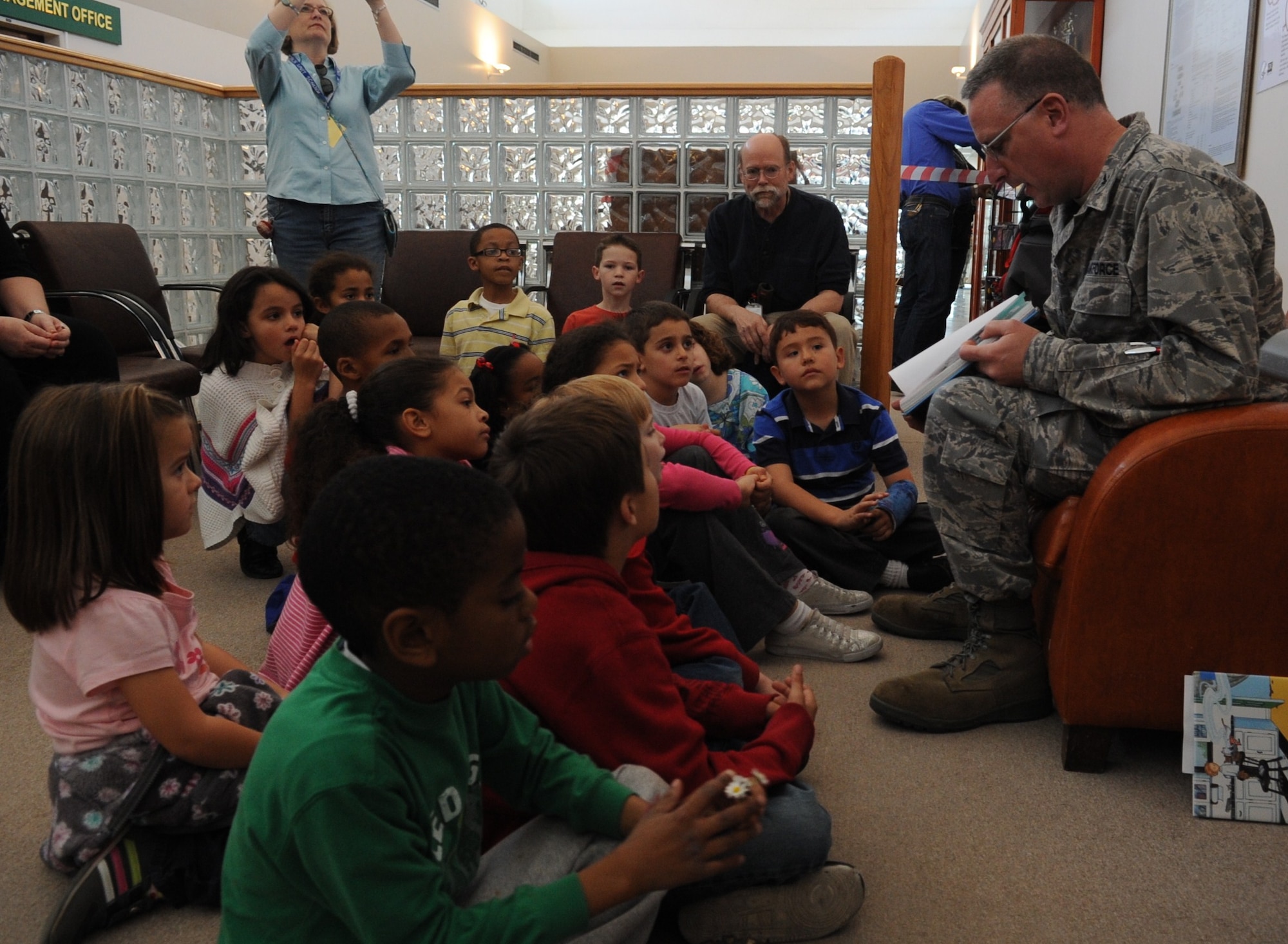 Col. Jay Cloutier, the 39th Medical Group commander, reads to children of an Incirlik Unit School 2nd grade class March 3, 2011, at Incirlik Air Base, Turkey, in support of the Reach Out and Read program.  Reach Out and Read is an evidence-based nonprofit organization that promotes early literacy and school readiness in pediatric exam rooms nationwide by giving new books to children and advice to parents about the importance of reading aloud.  (U.S. Air Force photo by Airman 1st Class Clayton Lenhardt/Released)