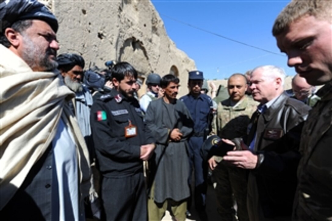 Secretary of Defense Robert M. Gates speaks with local elders, the Village Council and the District Police Chief during a visit to the village outside of Combat Outpost Kowall in Afghanistan on March 8, 2011.  