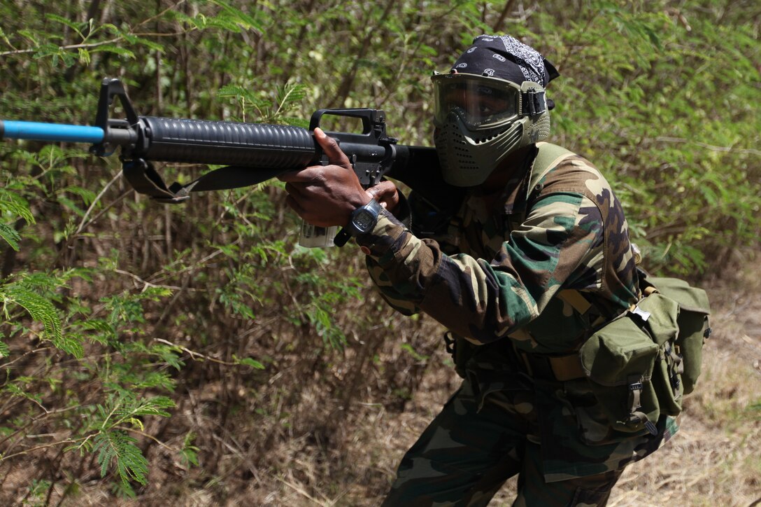 A Jamaican soldier aims in at an enemy combatant during close quarters battle training, March 8, as part of exercise Tradewinds 2011.