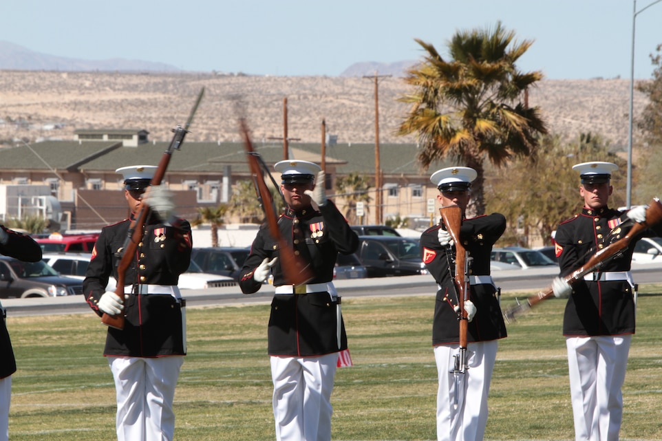 Marines with the Marine Corps Silent Drill Platoon perform their trademark rifle spin March 9, 2011 at the Combat Center’s Lance Cpl. Torrey L. Gray Field. The Marine Corps Battle Color Detachment also included the Marine Corps Drum and Bugle Corps, as well as the Corps’ color guard.