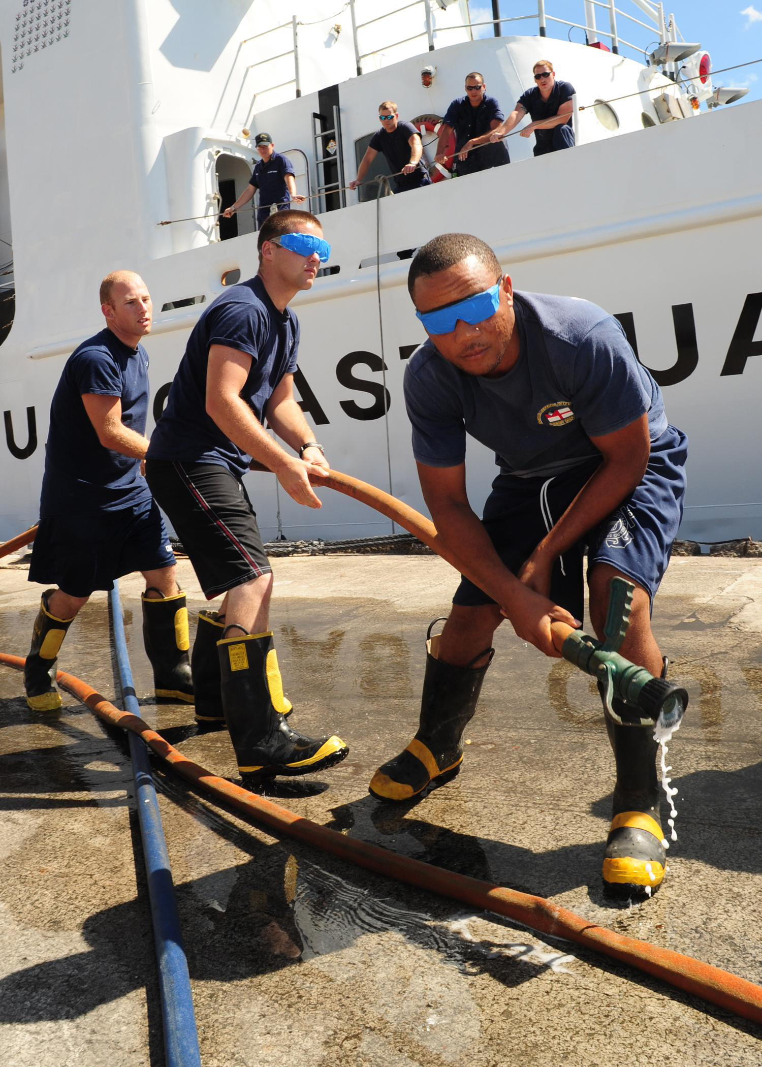 Seaman Brian Wells, Seaman Allen Rouse and leading Seaman Titre Addy, of the Antigua and Barbuda Defense Force Coast Guard, assume control of a fire hose during a shipboard firefighting demonstration alongside the U.S. Coast Guard Cutter Diligence during Exercise Tradewinds 2011, March 9. Tradewinds is an annual exercise designed to build relationships and enhance stability and inter-operability throughout the Caribbean region. (U.S. Coast Guard photo by Petty Officer 3rd Class George Degener).