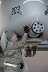 Airman 1st Class Matthew Stryjek, a crew chief assigned to the 354th Expeditionary Fighter Squadron, receives the first A-10C aircraft from Davis-Monthan Air Force Base, Arizona, to land at Osan Air Base, Republic of Korea, March 9.  The U.S. Air Force is deploying 12 A-10C aircraft from Davis-Monthan to Osan for approximately six months as part of a scheduled deployment. (U.S. Air Force photo/Senior Master Sgt. Paul Holcomb)