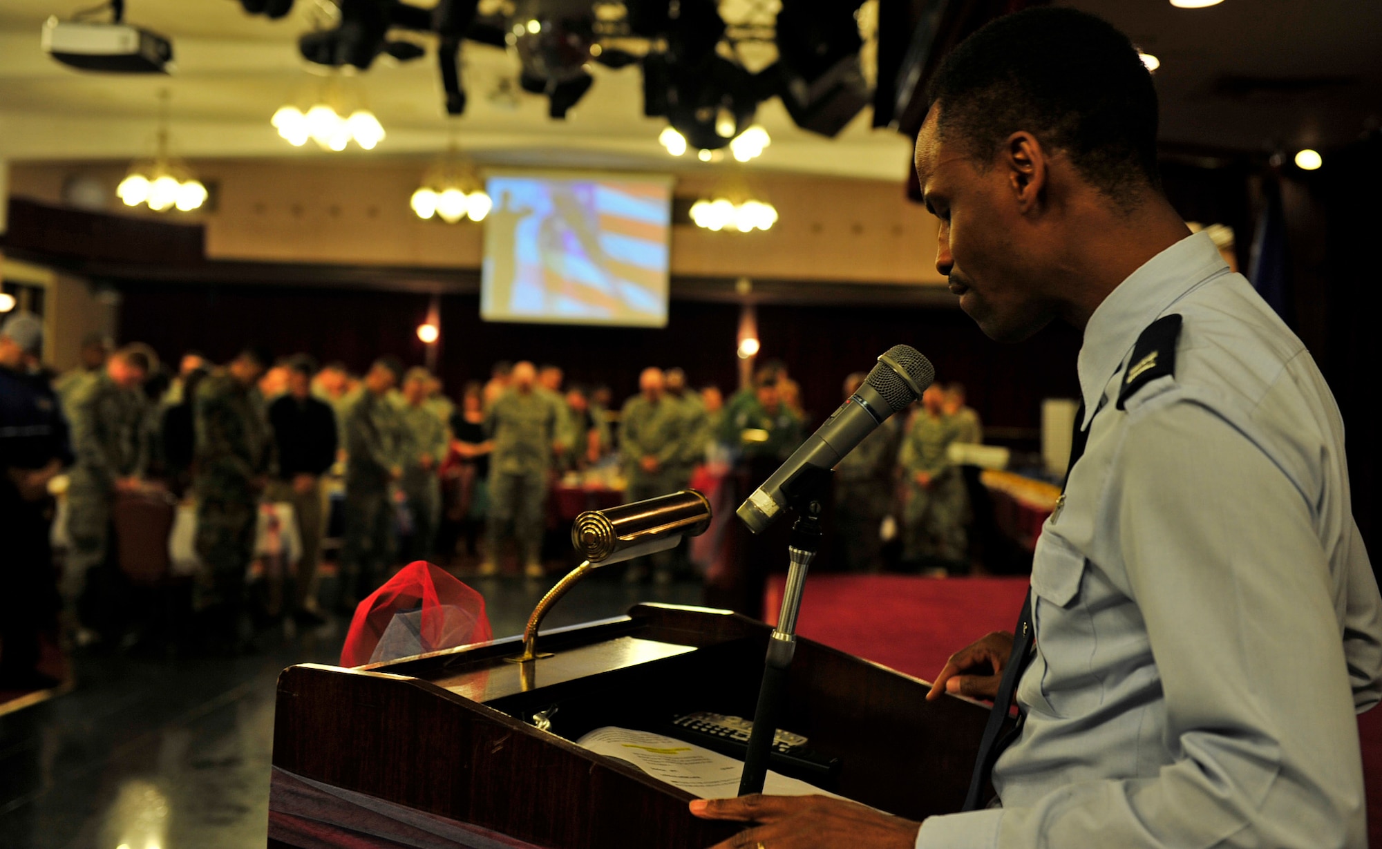 Chaplain (Capt.) Kennie Neal, 18th Wing chaplain, gives the benediction during the National Prayer Breakfast at Kadena’s NCO Rocker Club, March 10. Kadena Chaplain’s office earned the top status as the best Large Active Duty Chapel in Pacific Air Forces. (U.S. Air Force photo/Senior Airman Sara Csurilla)