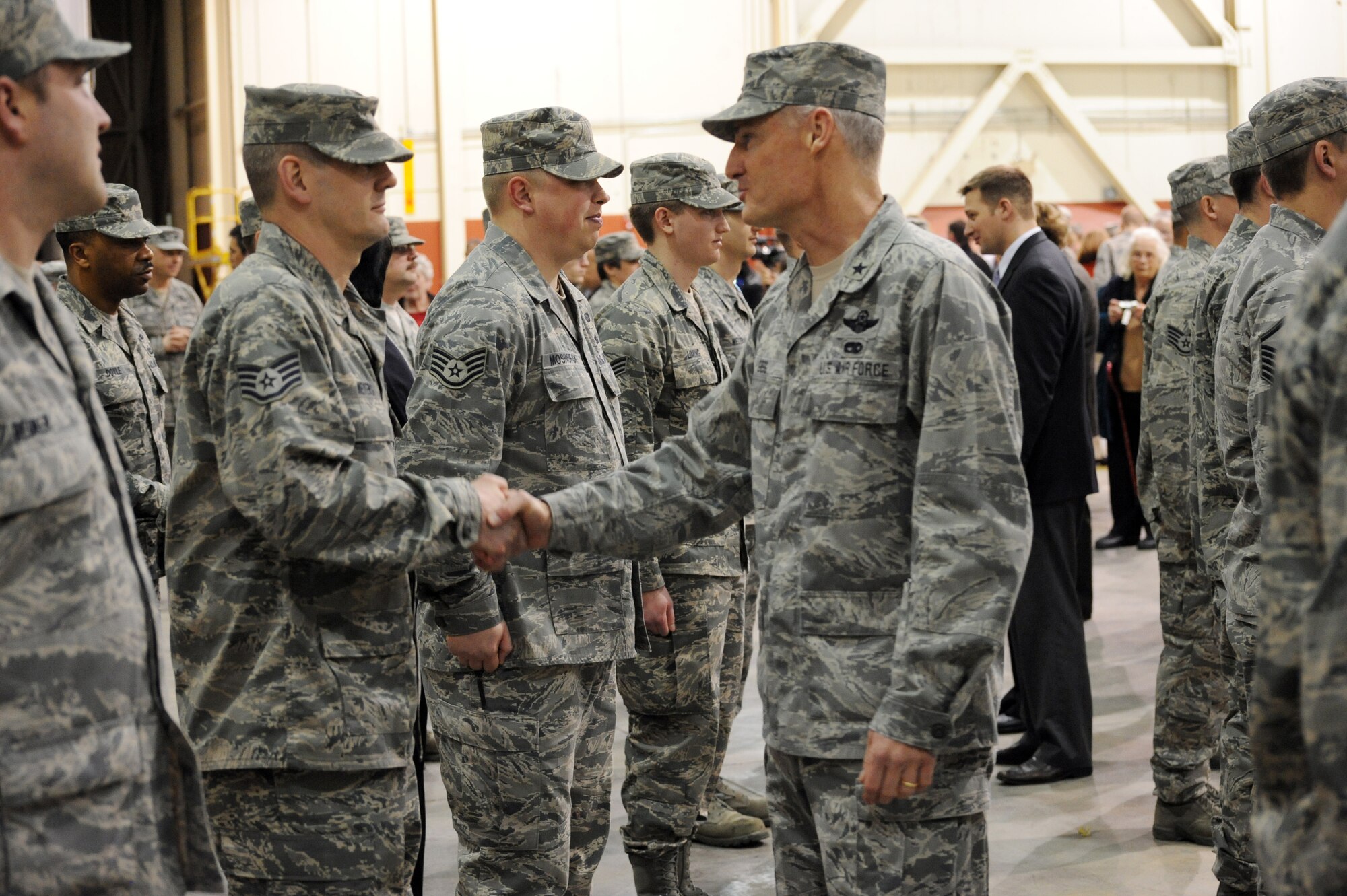 Oregon Congressman David Wu, meets with more than 80 Airmen of the Oregon Air National Guard's 116th Air Control Squadron, following the unit's mobilization ceremony at the Portland Air Guard Base in Portland, Ore., Mar. 4.  Kitzhaber, Maj. Gen. Raymond F. Rees, Adjutant General, Oregon; Brig. Gen. Steven Gregg, Oregon Air National Guard Commander; and other dignitaries, along with hundreds of family, friends, fellow Airmen and Soldiers attended the event.  The unit's Airmen will deploy to the Middle East in support of Air Forces Central (CENTAF), where they will perform Air Battle Management missions for four months.  (U.S. Air Force photograph by Tech. Sgt. John Hughel, 142nd Fighter Wing Public Affairs)