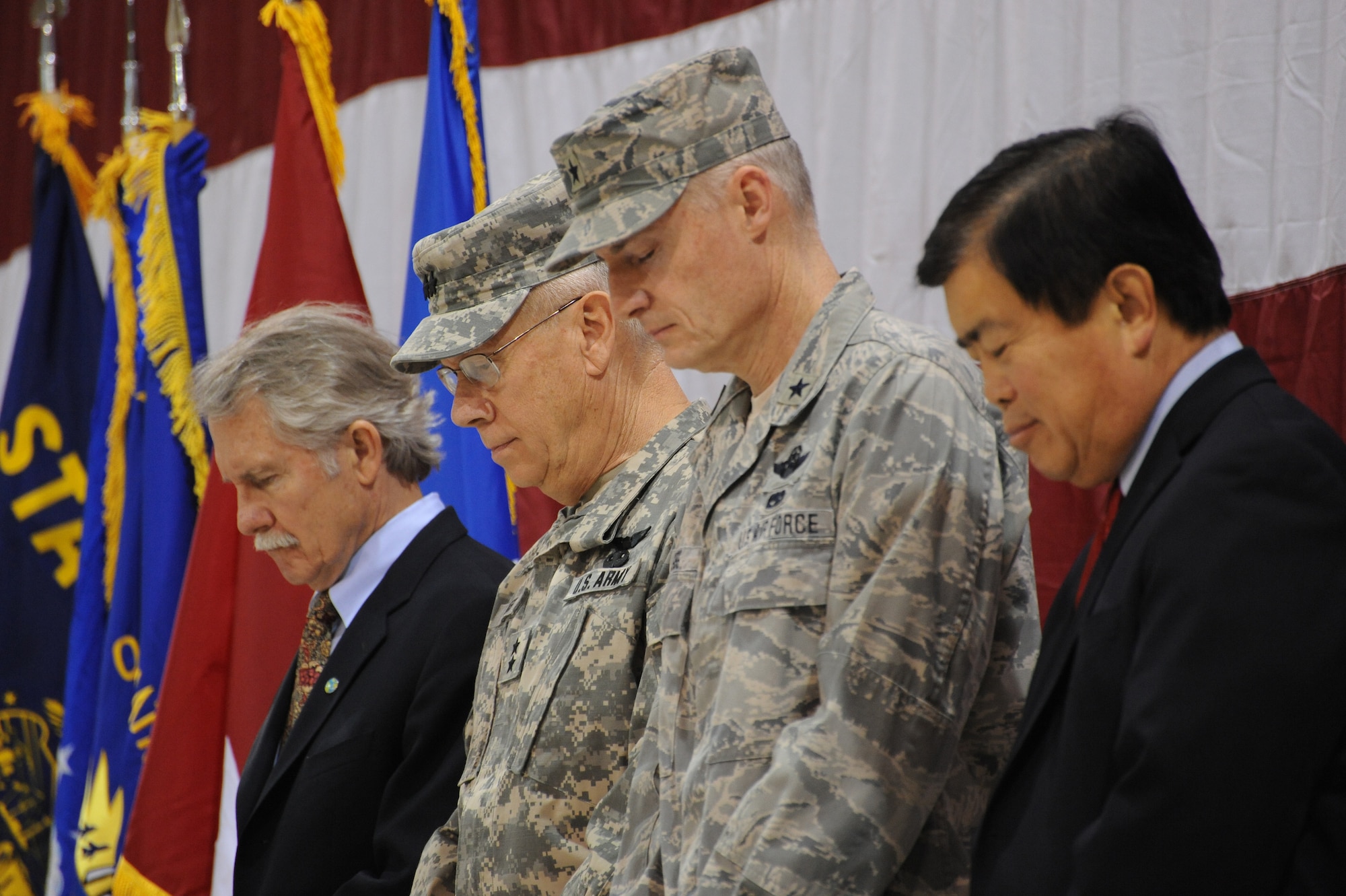 Oregon Governor John Kitzhaber, (Left to right) Maj. Gen. Raymond F. Rees, Adjutant General, Oregon, Brig. Gen. Steven Gregg, Commander of the Oregon Air National Guard, and Congressman David Wu (OR-District 1), pause for reflection during the Invocation of the 116th Air Control Squadron mobilization ceremony held at the Portland Air National Guard Base, Portland, Ore., on March 4, 2011. (U.S. Air Force photograph by Tech. Sgt. John Hughel, 142nd Fighter Wing Public Affairs)