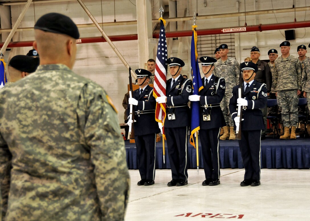 Niagara Falls Air Reserve Station Honor Guard presents the colors during a ceremony for members the National Guard 105th Military Police Company unit, March 9, 2011, Niagara Falls Air Reserve Station, NY. The members of the 105 are being deployed for a second time to an undisclosed location in south west Asia. (U.S. Air Force photo by Staff Sgt. Joseph McKee)