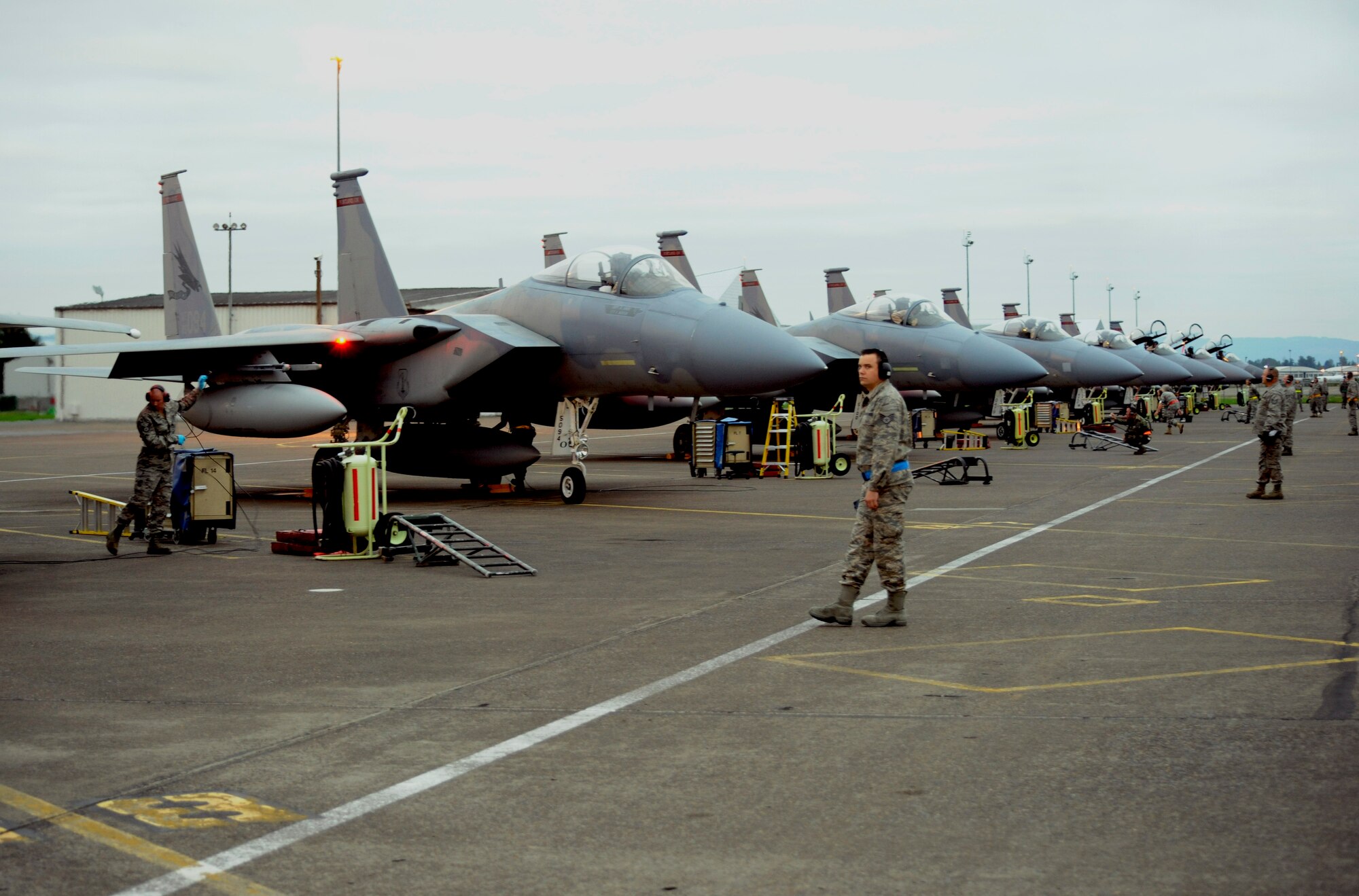 Airmen of the Oregon Air National Guard's 142nd Fighter Wing prepare six F-15 Eagles to depart for a 30-day overseas training tour in support of Exercise IRON FALCON to the United Arab Emirates Air Warfare Center on October 2, 2010. Along with the  six jets, 131 members of the Oregon Air National Guard also deployed to the UAE in support of Exercise IRON FALCON . (U.S. Air Force Photograph by Staff Sgt. John Hughel, 142nd Fighter Wing Public Affairs Office)