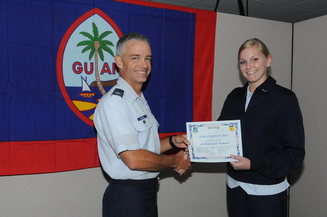 Col. Tod Fingal, 36 Wing Vice Commander, presents Airman 1st Class Katherine Beshoner, 36 Operations Support Squadron aviation resource management journeyman, with the Andersen’s Best award March 7.  Airman Beshoner skillfully compiled the weekly operations and maintenance scheduling brief and identified numerous scheduling conflicts facilitating the successful completion of 117 flying sorties totaling 469 hours.   Although Airman Beshoner has been in the Air Force less than three years, her maturity and willingness to go above and beyond have helped her in her career and has made a name for herself. (U.S. Air Force photo/ Senior Airman Carlin Leslie)