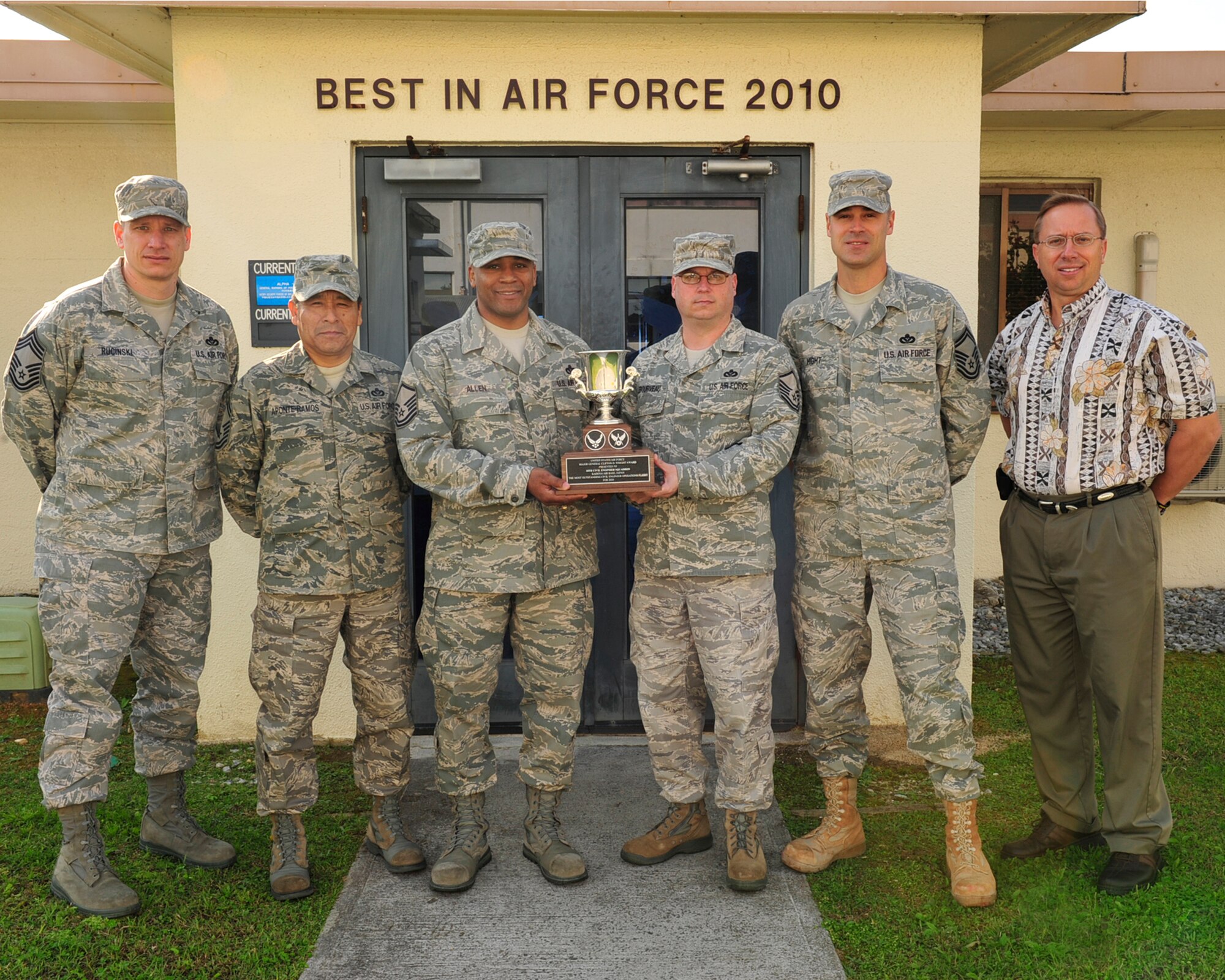 Members of the 18th Civil Engineer Squadron, Operations Flight (left to right), Chief Master Sgt. Robert Rucinski, operations flight superintendent, Senior Master Sgt. Carlos Aponte-Ramos, operations support superintendent, Master Sgt. King Allen, facilities superintendent, Master Sgt. Chris Lebourveau, infrastructure superintendent, and Mr. Gary Gentz, operations and maintenance chief, display the 2010 Air Force Major General Clifton D. Wright Award here at Kadena Air Base, March 9.  They represented a flight of 600 personnel who were recognized as the most outstanding CE Operations Flight in the performance of quality maintenance, repair, and improvement of installation facilities and infrastructure. (U.S. Air Force photo/Staff Sgt. Lakisha A.Croley)