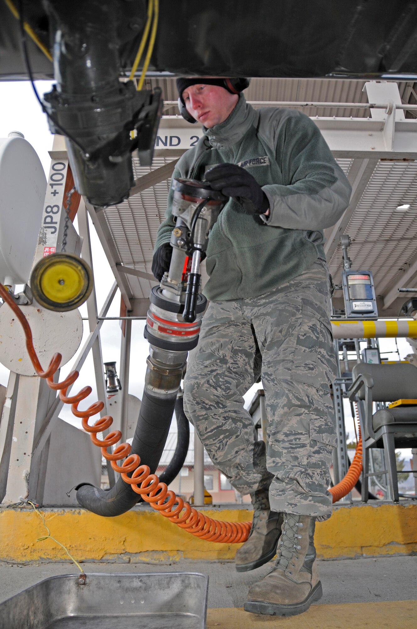 Staff Sgt. Colin Carr pumps prepares to fill a waiting tanker truck before taking it to the flightline to refuel jets returning from missions flown in the morning.
