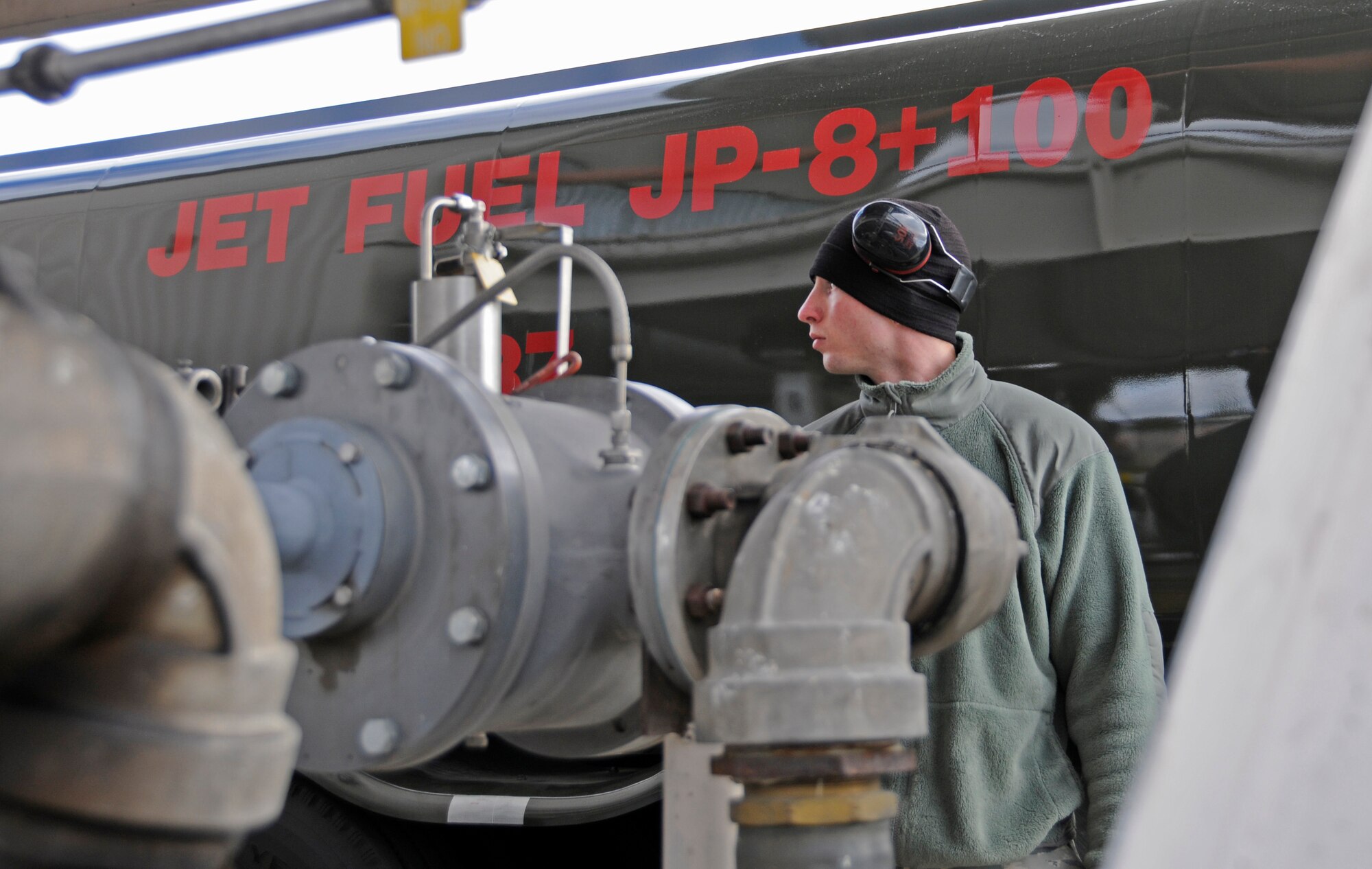 Staff Sgt. Colin Carr pumps about 1,500 gallons of jet fuel to one of a fleet of fuel trucks before taking it to the flightline to refuel jets returning from missions flown in the morning.