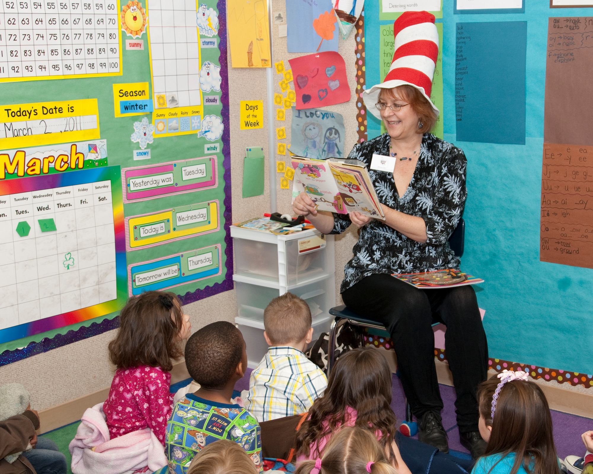 Michele Miller, senior administrative assistant to the Edwards Joint Strike Fighter site director, reads to a Branch Elementary class as part of Read Across America March 2. The celebration, held in honor of the birthday of Theodore Geisel, better known by his pen name, Dr. Seuss, is held annually as a day for adults to share a love for reading with children. (Air Force photo by Paul Weatherman) 