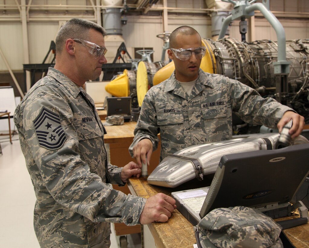 Chief Master Sgt. Robert Newman, command chief for the 33rd Fighter Wing at Eglin Air Force Base, Fla., gets instruction from a 361st Training Squadron Airman in Training March 2 during a tour stop at the propulsion schoolhouse. The chief and other Air Education and Training Command leaders were at Sheppard AFB Feb. 28-March 3 for the command's spring conference. (U.S. Air Force photo/Airman 1st Class Adawn Kelsey)