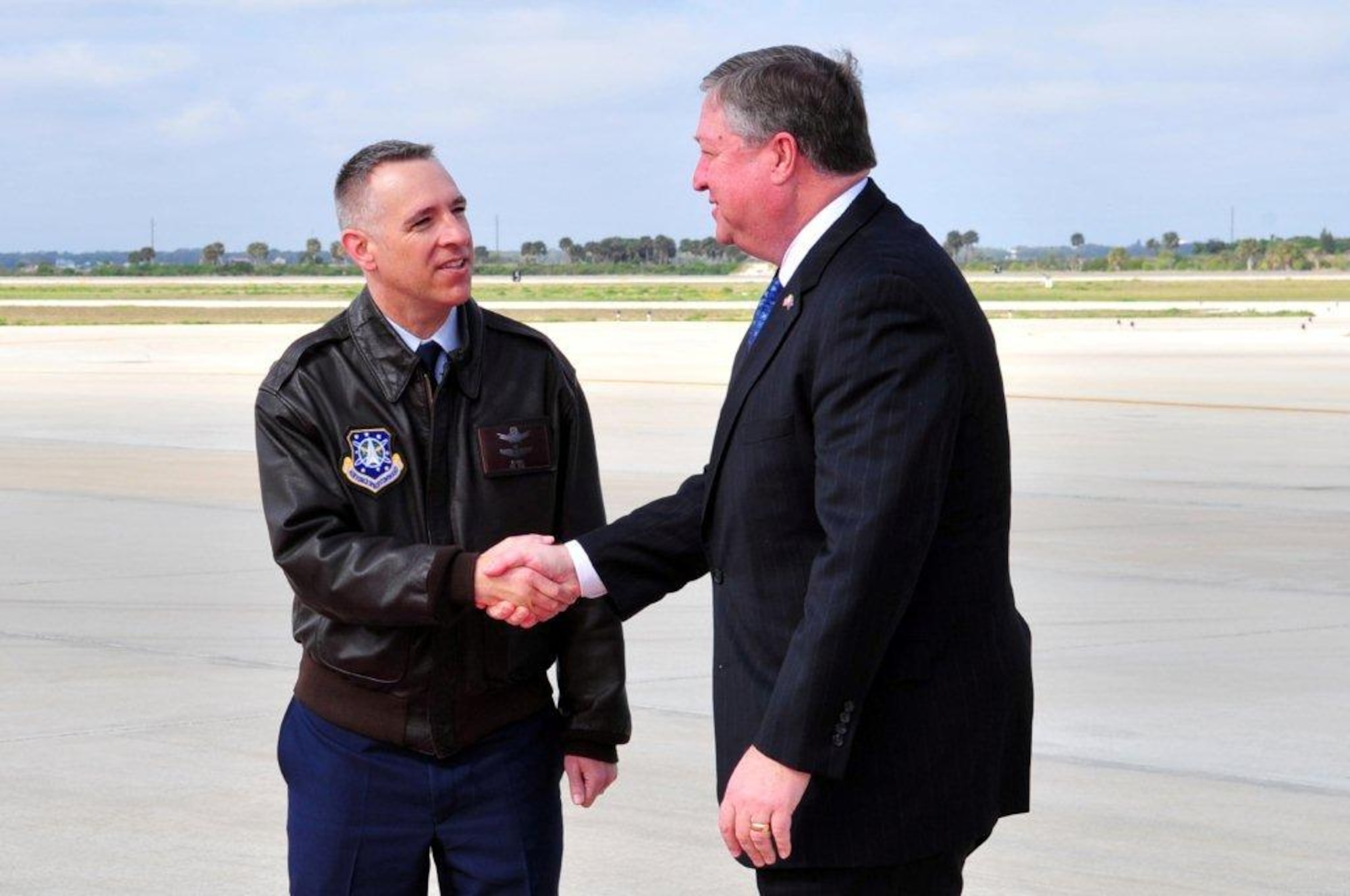 Col. James Ross, 45th Space Wing vice commander, greets Secretary of the Air Force Michael Donley upon his arrival at Patrick Air Force Base, Fla., on March 7, 2011. Secretary Donley later toured facilities at Cape Canaveral Air Force Station and Kennedy Space Center. 