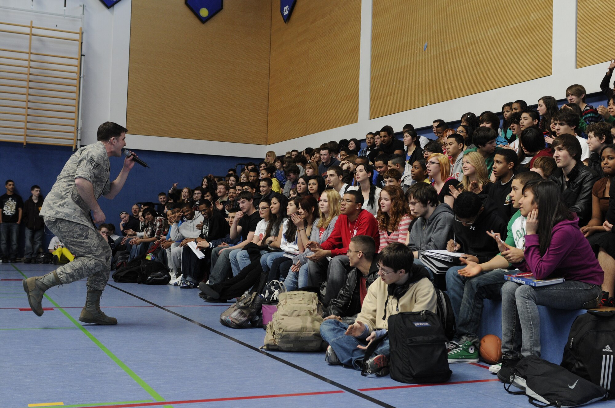 HOHENFELS, Germany – Staff Sgt. Craig Bowman, U.S. Air Forces in Europe Band Touch ‘n Go vocalist, sings to students at Hohenfels Middle and High School on U.S. Army Garrison Hohenfels, Germany, during a performance March 8. Touch ‘n Go performed for more than 300 students at the school as part of a Music in Our Schools tour throughout Bavaria. (U.S. Air Force photo/Staff Sgt. Kali L. Gradishar)