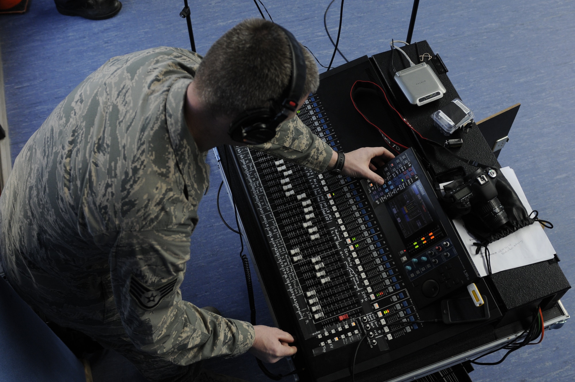 HOHENFELS, Germany – Staff Sgt. Nicholas Wellman, U.S. Air Forces in Europe Band Touch ‘n Go audio engineer, manages audio levels during the band’s performance at Hohenfels Middle and High School on U.S. Army Garrison Hohenfels, Germany, March 8. Touch ‘n Go performed for more than 300 students at the school as part of a Music in Our Schools tour throughout Bavaria. (U.S. Air Force photo/Staff Sgt. Kali L. Gradishar)