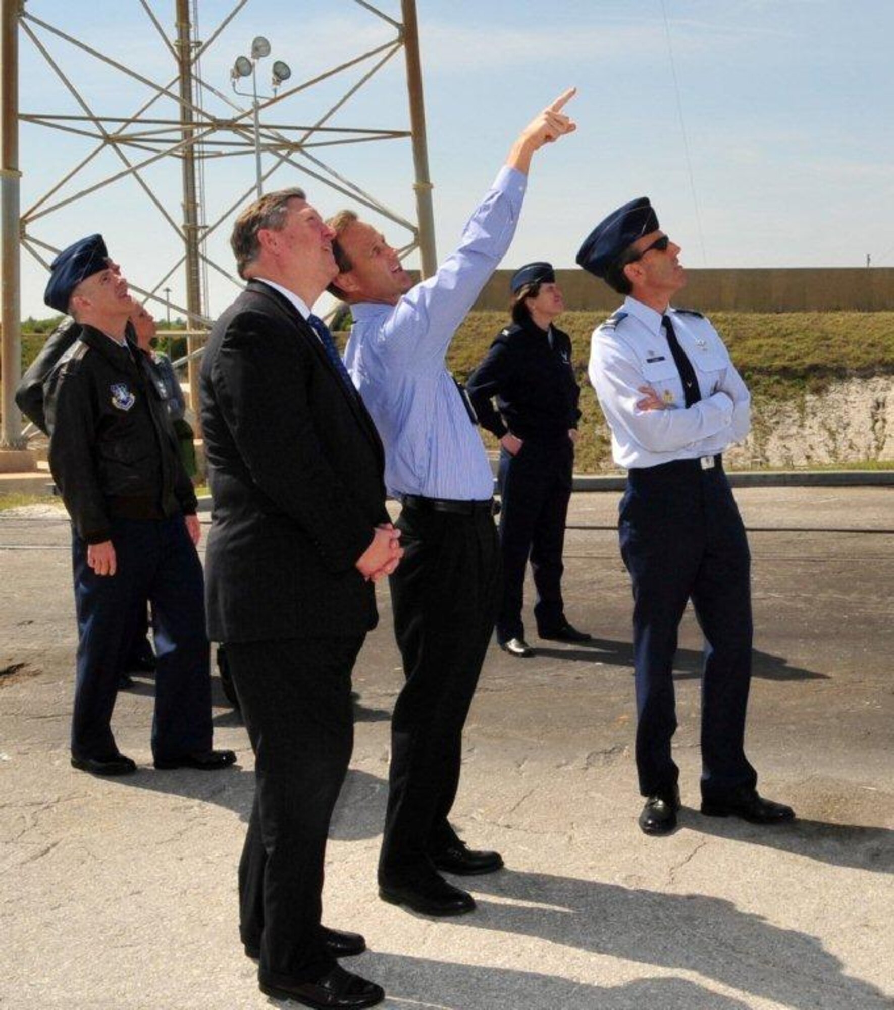 Space X employee Scott Henderson, center, briefs Secretary of the Air Force Michael Donley on the Eastern Range on March 7, 2011. Also pictured are Col. Lee Rosen, right, 45th Launch Group commander, and Col. James Ross, left, 45th Space Wing vice commander. (U.S. Air Force Photo/Jennifer Macklin)

