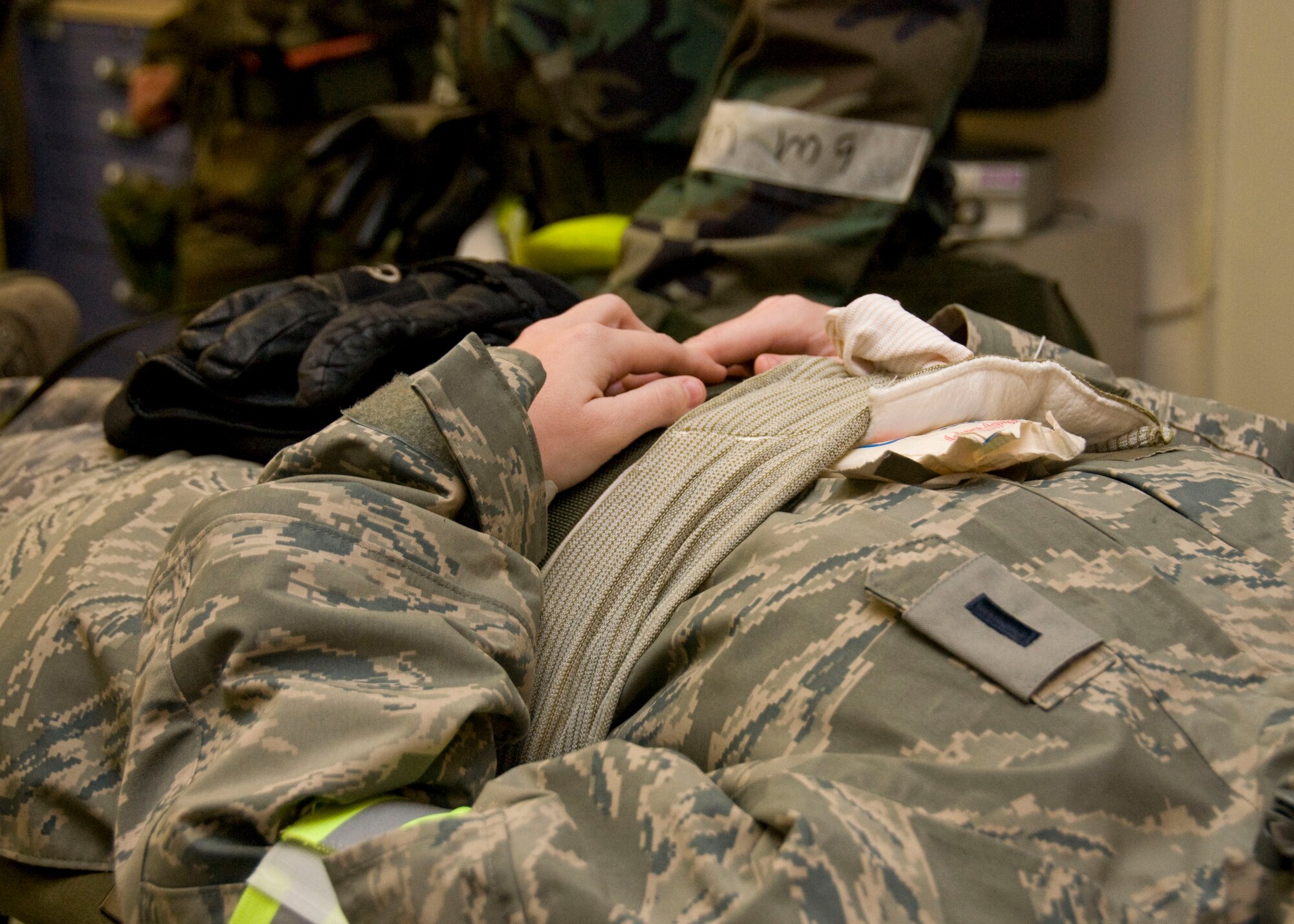 YOKOTA AIR BASE, Japan -- A simulated mortar attack victim waits for treatment for an open chest wound inside the emergency medical facility during an Operational Readiness Exercise here March 9. During the ORE, exercise planners evaluate base leadership, emergency responders and participating Airmen on their ability to respond to complex real-world scenarios. (U.S. Air Force photo/Airman 1st Class Andrea Salazar)
