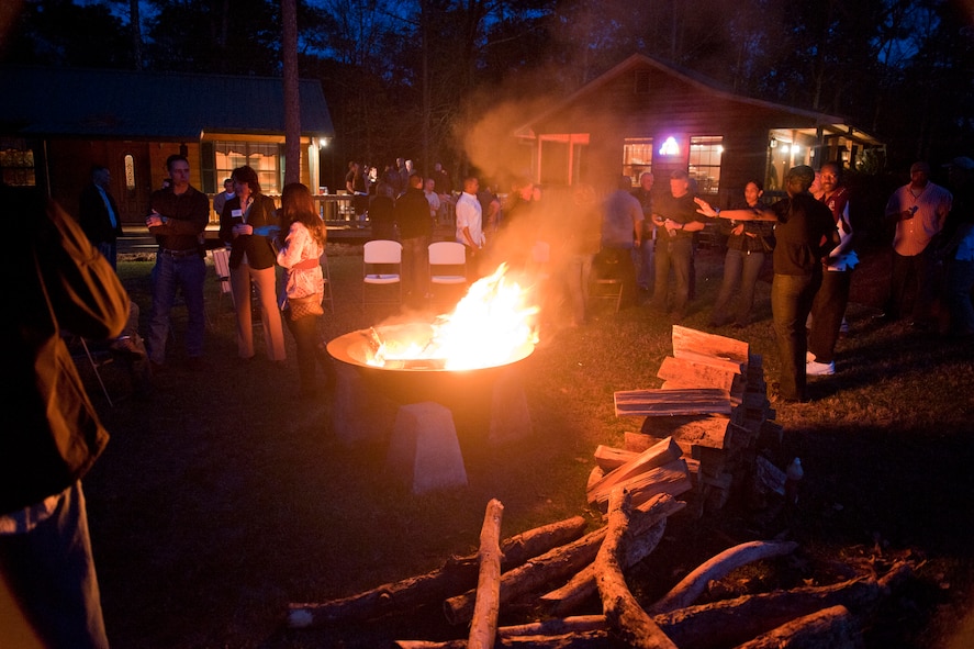 Nominees of the 2010 9th Air Force Outstanding Performers of the Year, along with their family and friends, and leadership from the 9th Air Force, 23rd Wing and 93rd Air Ground Operations Wing, socialize around a campfire March 8 in Barney, Ga. Many local civilian supporters of Moody Air Force Base attended the gathering. (U.S. Air Force photo/Staff Sgt. Jamal D. Sutter)(RELEASED)
