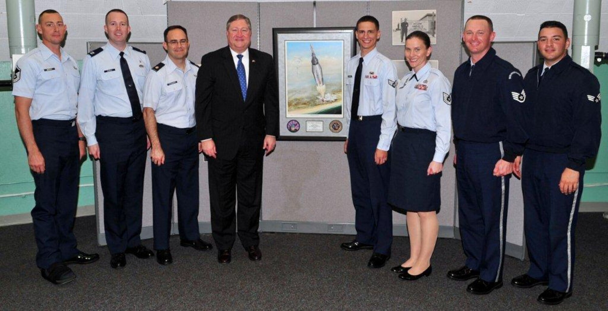 Secretary of the Air Force Michael Donley poses with 45th Space Wing Airmen during a visit to Patrick Air Force Base, Fla., on March 7, 2011.  The Airmen were recently named "Best of 2010" during the Wing's Annual Award Banquet held last month.  With the Secretary are (left to right) Master Sgt. Adam Brothers, Capt. Jonathan Semple, Maj. Mark Shoemaker, Senior Airman Nathaniel Kirschman, Tech. Sgt. Mari Quiroga, Staff Sgt. Derek Miller and Senior Airman Manny Rivero. (U.S. Air Force Photo/Jennifer Macklin)
