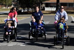 Lisa Talbot (left), Nicole Hammock and Nancy Luciani, walk a two-mile course with their children at Joint Base Charleston - Weapons Station, March 2, during the Stroller Roller class offered by the Morale, Welfare and Recreation office. (U.S. Navy photo/Machinist's Mate 3rd Class Brannon Deugan)