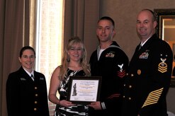 The Navy League Charleston honored local area Sailors of the Year at a ceremony held on Joint Base Charleston - Weapons Station, Feb. 24. Pictured (left to right) are Lt. Cmdr. Erica Hoffman, executive officer of Nuclear Power Training Unit, Mrs. Howart, Machinist's Mate 1st Class Nicholas Howart, NPTU Sailor of the Year and Master Chief Petty Officer, Wayne Robbins, NPTU command master chief. (photo by Mr. Albert Millon)
