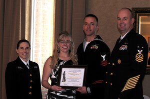 The Navy League Charleston recently honored local area Sailors of the Year at a ceremony held on Joint Base Charleston - Weapons Station. Pictured (left to right) after receiving his award are Lt. Cmdr. Erica Hoffman, executive officer of Nuclear Power Training Unit, Mrs. Howart, Machinist's Mate 1st Class Nicholas Howart, NPTU Sailor of the Year and Master Chief Petty Officer, Wayne Robbins, NPTU command master chief.
