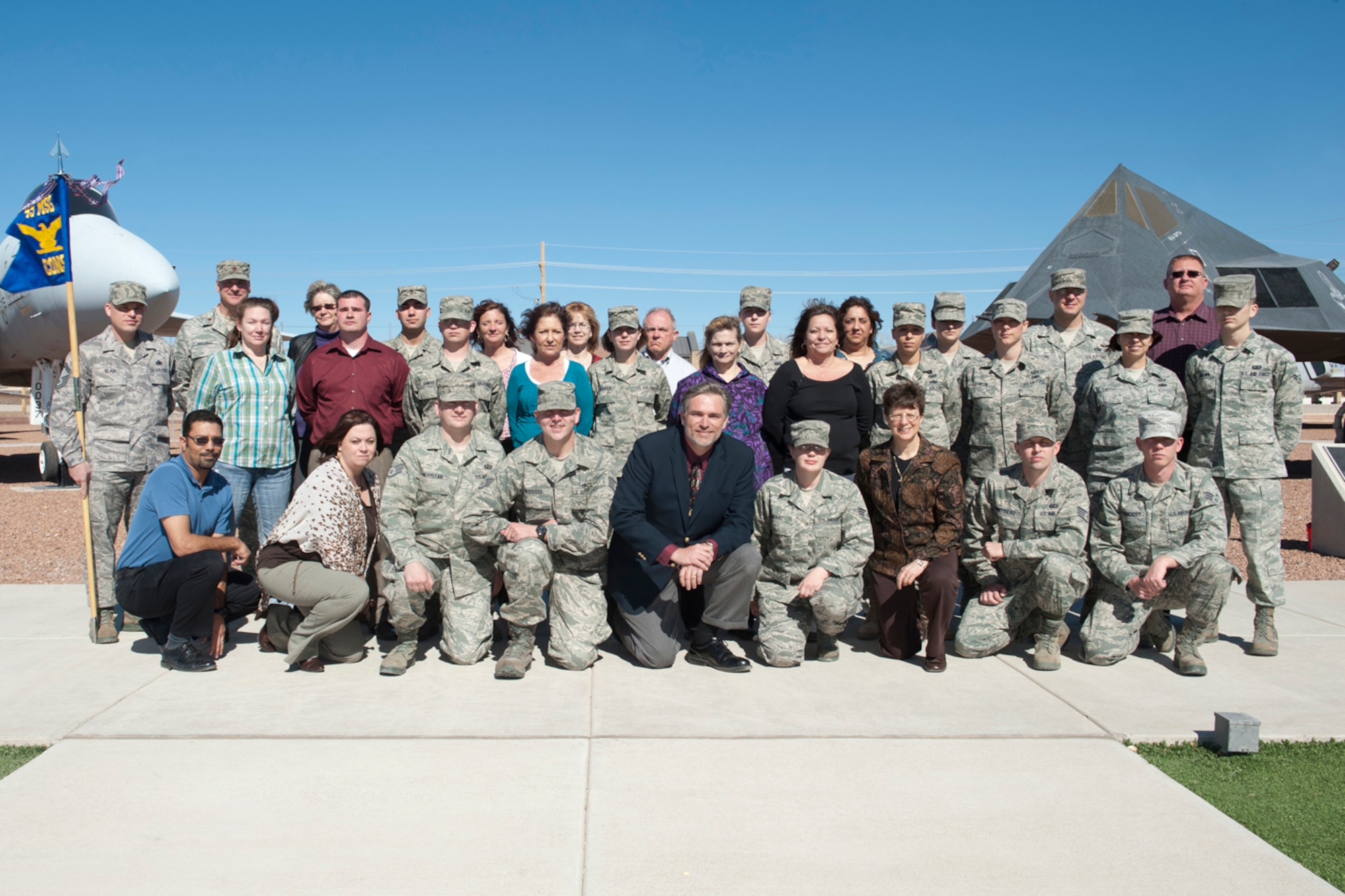 HOLLOMAN AIR FORCE BASE, N.M. -- The 49th Contracting Squadron pauses for a photo, Feb. 22, 2011, at Heritage Park shortly after being named the 49th Wing’s Small Unit of the Year. With approximately 40 members, and a demanding deployment tempo, the 49th CONS managed to meet the needs of the base in 2010, resulting in 1,114 contract actions worth more than $66.9 million -- their highest in five years. (U.S. Air Force photo by Senior Airman Veronica Stamps/Released)