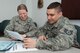 HANSCOM AIR FORCE BASE, Mass. – Staff Sgt. Joshua Rager (right), from the 66th Comptroller Squadron, gives information about a Community College of the Air Force degree to Staff Sgt. Karey Garrison, from the 64th Air Refueling Squadron at Pease Air National Guard Base, N.H., in the Brown Building on March 8. As part of the Year of the Community College of the Air Force initiative, Sergeant Rager volunteers as a partner in education and encourages other Airmen at Hanscom and geographically separated units to seek their CCAF degree. (U.S. Air Force photo by Rick Berry)