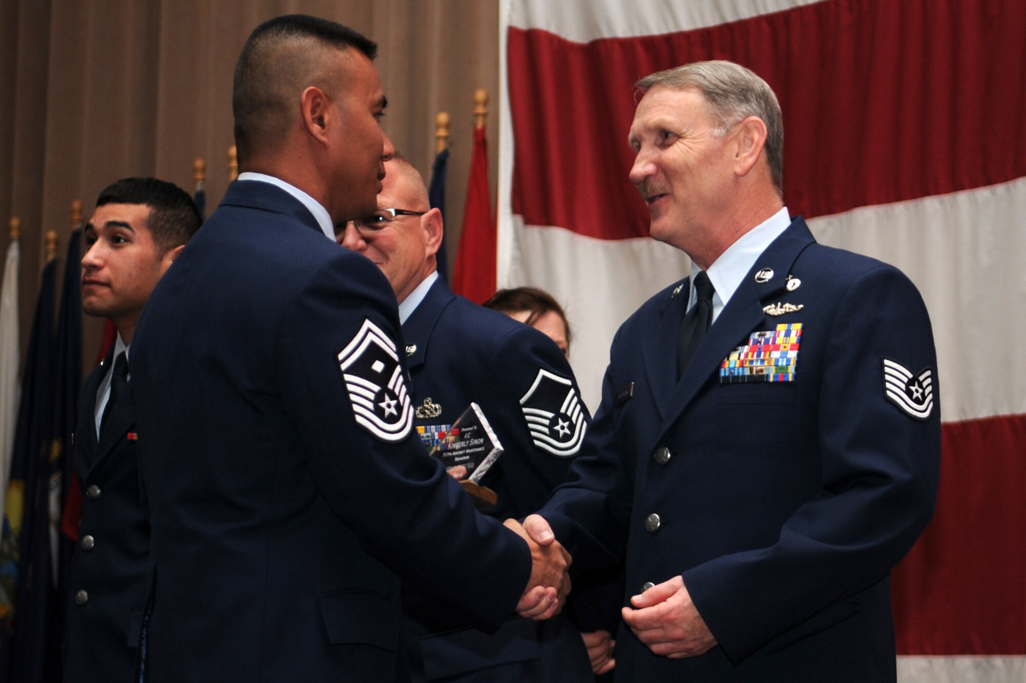 Senior Master Sgt. Joseph Thomerson, the 307th Bomb Wing’s First Sergeants representative presents Technical Sgt. Jeff Walston, public affairs technician, 307th Bomb Wing, with a “Diamond Sharp Award” during the first ever “Barksdale Reserve Awards Ceremony” in Hoban Hall at Barksdale Air Force Base, La., March 6, 2011. Sergeant Walston was chosen as the 917th Wing’s Noncommissioned Officer of the Year 2010. The awards ceremony was the first to be held since the deactivation of the 917th Wing, and reactivation of the 307th Bomb Wing. It brings together all of the Reserve components at Barksdale AFB to recognize the accomplishments of their Airmen. (U.S. Air Force photo/Master Sgt. Greg Steele)