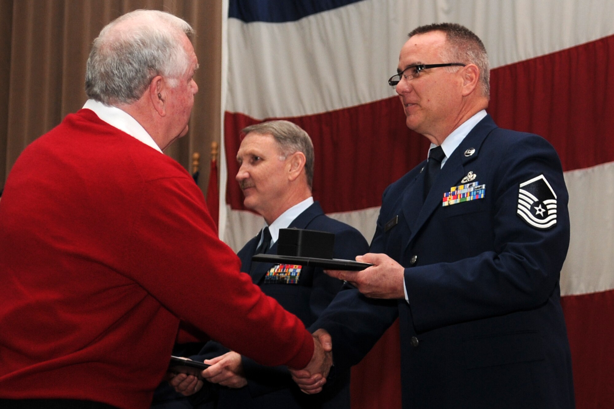 Mr. Don Reed, from GEICO, presents Master Sgt. Danny Fischer, aircraft armament systems mechanic, 307th Maintenance Squadron, with awards from GEICO for being chosen the 917th Wing’s Senior Noncommissioned Officer of the quarter for October to December 2010, during the first ever “Barksdale Reserve Awards Ceremony” at Hoban Hall on Barksdale Air Force Base, La., March 6, 2011. Sergeant Fischer was also named The 917th Wing’s SNCO of the Year for 2010. The awards ceremony was the first to be held since the deactivation of the 917th Wing, and reactivation of the 307th Bomb Wing. It brings together all of the Reserve components at Barksdale AFB to recognize the accomplishments of their Airmen. (U.S. Air Force photo/Master Sgt. Greg Steele)