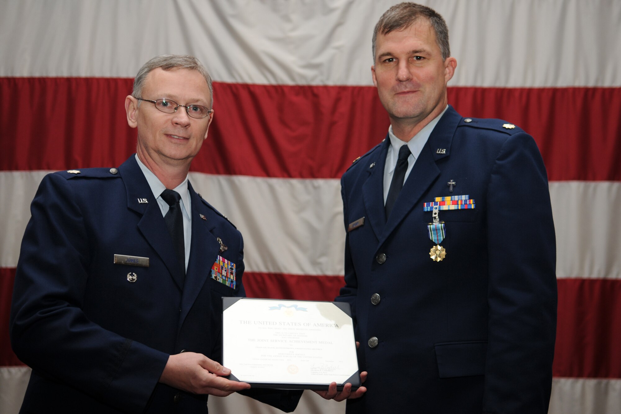 Colonel (S) Joseph Jones, vice commander, 307th Bomb Wing, poses with Maj. Kenneth Brown, chaplain, 307th Bomb Wing, during the first ever “Barksdale Reserve Awards Ceremony” at Hoban Hall on Barksdale Air Force Base, La., March 6, 2011. Major Brown was awarded the Joint Service Achievement Medal for meritorious service for the Armed Forces of the United States. The awards ceremony was the first to be held since the deactivation of the 917th Wing, and reactivation of the 307th Bomb Wing. It brings together all of the Reserve components at Barksdale AFB to recognize the accomplishments of their Airmen. (U.S. Air Force photo/Master Sgt. Greg Steele)