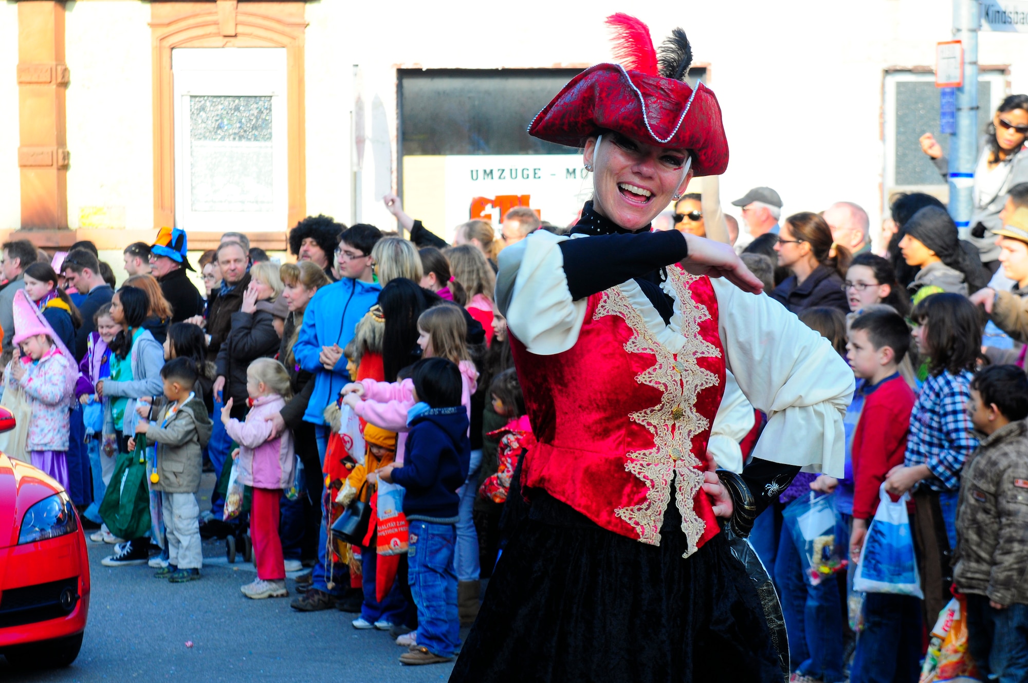 Parade participants celebrate the annual Fasching parade in Ramstein village, Germany, March 8, 2011. This annual event is a pre-Lenten carnival which is celebrated with the donning of wild and fancy costumes to chase away the evil spirits of winter in preparation for spring. (U.S. Air Force photo by Airman 1st Class Brea Miller)