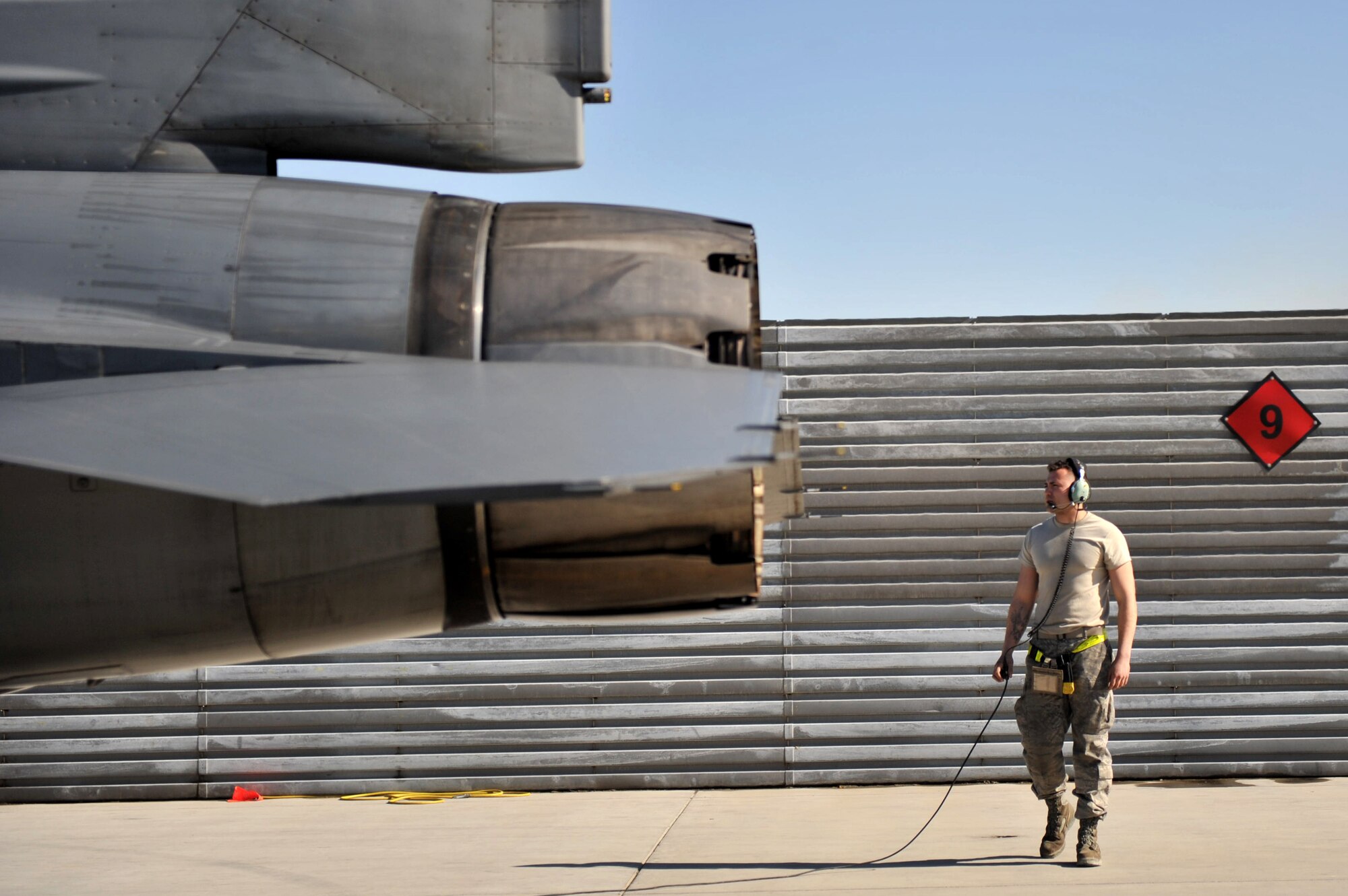 Senior Airman Rosendo Meza, 455th Expeditionary Aircraft Maintenance Squadron, runs through a preflight check on an F-16 Fighting Falcon before it takes off at Bagram Airfield, Afghanistan, March 9, 2011. Airman Meza is deployed from Hill Air Force Base, Utah. (U.S. Air Force photo by Senior Airman Sheila deVera)