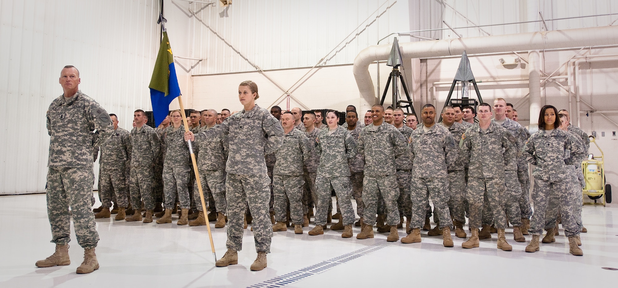 The Soldiers and Airmen of the Kentucky National Guard Agribusiness Development Team III stand in formation during a farewell ceremony March 4, 2011, at the Kentucky Air National Guard base in Louisville, Ky. The team, which is slated to deploy to Afghanistan in April, will help Afghan locals regain their agricultural heritage by teaching modern farming and livestock skills as well as the business of agriculture. (U.S. Army photo by Staff Sgt. Aaron Hiler, 133rd Mobile Public Affairs Detachment)