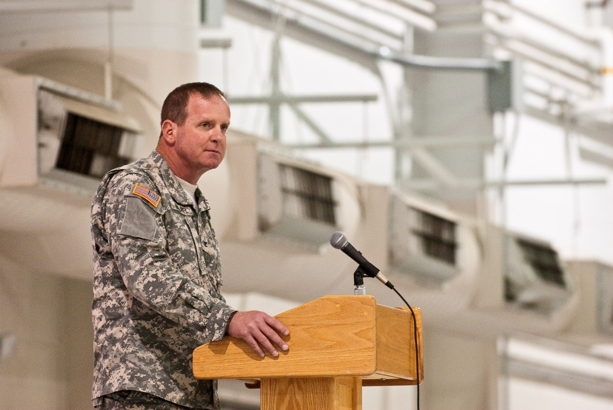 Col. Neil Mullaney, commander of the Kentucky National Guard's Agribusiness Development Team III, speaks to Soldiers, Airmen and family members during the team's farewell ceremony March 4, 2011, at the Kentucky Air National Guard Base in Louisville, Ky. Team members, who come from the Kentucky Army and Air National Guard, are deploying to Afghanistan in April to help Afghan farmers become agriculturally self-sufficient. Colonel Mullaney is the first Air Guard officer to lead a Kentucky Agribusiness Development Team. (U.S. Army photo by Staff Sgt. Aaron Hiler, 133rd Mobile Public Affairs Detachment)