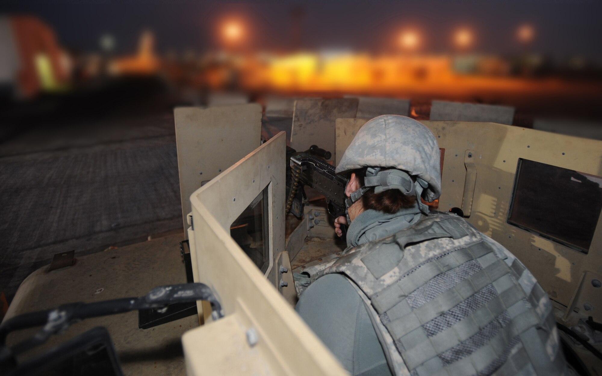 On Feb. 18, 2011, Airman 1st Class Star Bumblis, 380th Expeditionary Security Forces Squadron, stays on target, protecting the base should any violators try to access an entry control point in this Southwest Asia location. Keeping Security Forces on 24-hour watch helps minimize the frequency of threats on base. Airman Bumblis is deployed from the 95th SFS, Edwards AFB, Calif. (U.S. Air Force photo by Senior Airman Maynelinne De La Cruz)
