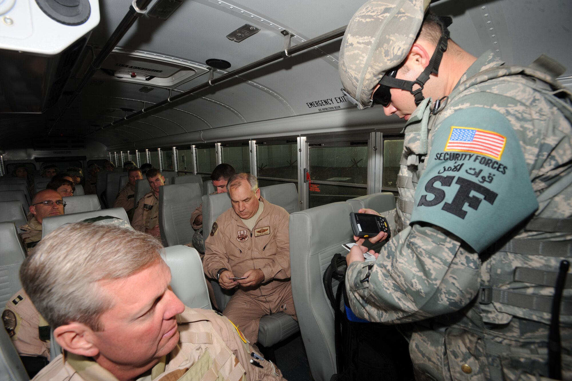 Senior Airman Christopher Powell, 380th Expeditionary Security Forces Squadron, checks for the proper identification cards needed for passing through an entry control point Feb. 14, 2011, in Southwest Asia. Keeping Security Forces on 24-hour watch helps minimize the frequency of threats on the base. Airman Powell is deployed from the 30th SFS, Vandenberg, Calif. (U.S. Air Force photo by Senior Airman Maynelinne De La Cruz) 