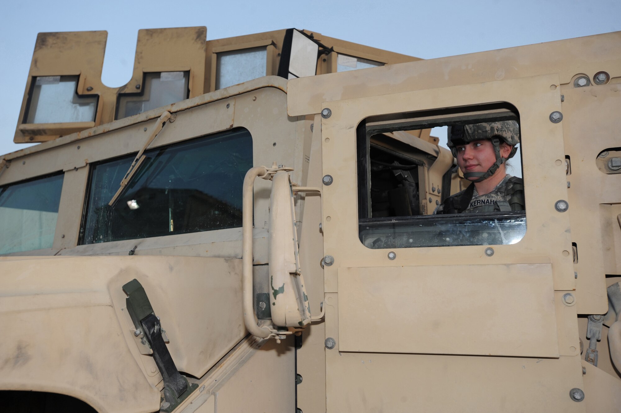 Airman 1st Class Tara Kernahan, 380th Expeditionary Security Forces Squadron, stands guard in front of the finance building after the building alarm was set off. Keeping Security Forces on 24-hour watch helps minimize the frequency of threats on base. Airman Kernahan is deployed from the 75th SFS, Hill AFB, Utah. (U.S. Air Force photo by Senior Airman Maynelinne De La Cruz)