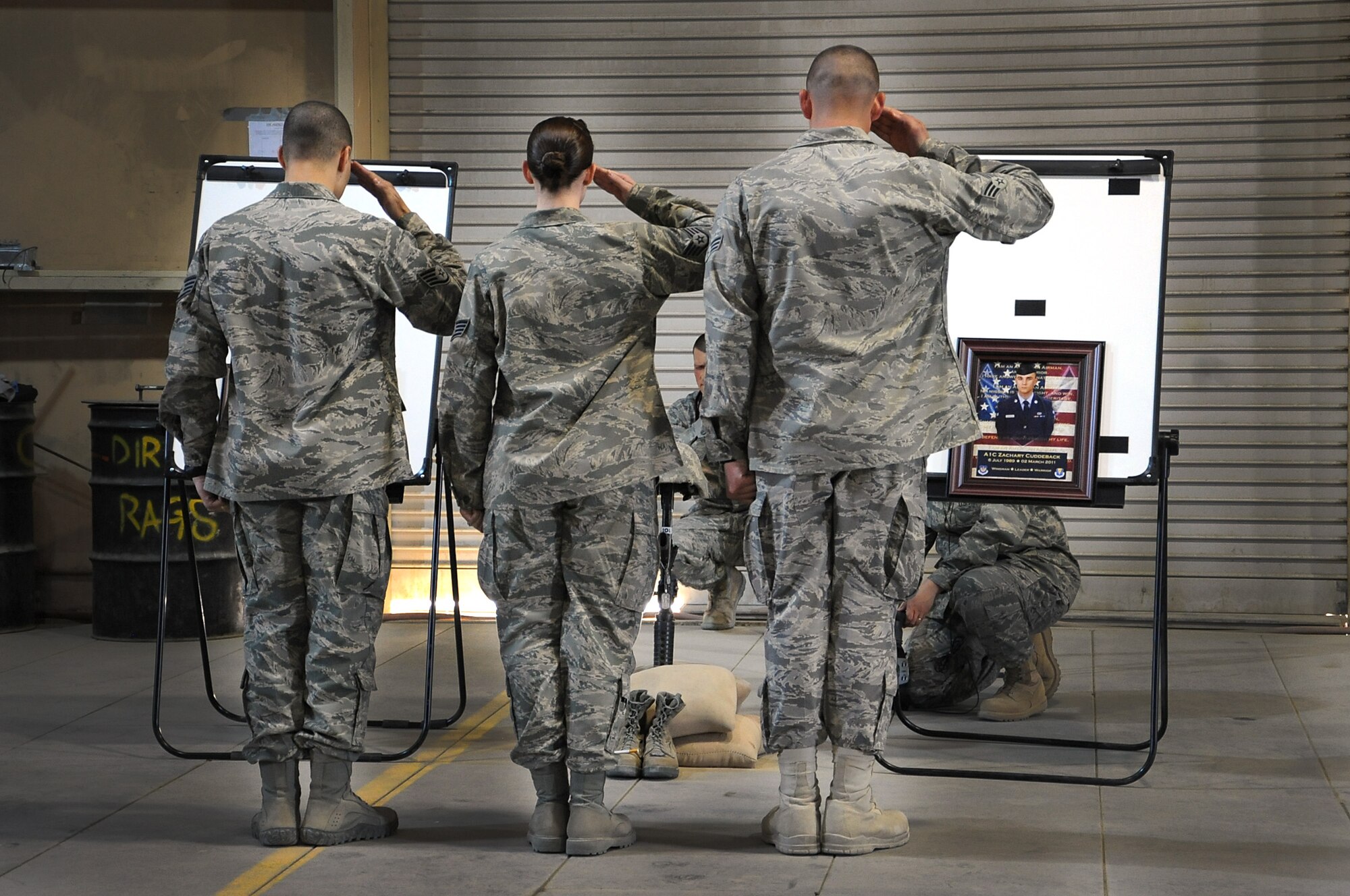 Airmen with the 386th Air Expeditionary Wing deployed to Southwest Asia from Ramstein Air Force Base, Germany, held a memorial service March 5, for Airman 1st Class Zachary Cuddeback who was killed March 2 at Terminal 2 of the Frankfurt (Germany) Airport. (U.S. Air Force photo by Senior Airman Cynthia Spalding)
