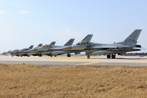 KUNSAN AIR BASE, Republic of Korea -- F-16D Fighting Falcons from the 80th Fighter Squadron and 38th Fighter Group prepare for takeoff here March 9 as part of an exercise called, "Buddy Wing." This exercise a combined fighter exchange program designed to improve interoperability between the U.S. Air Force and ROK Air Force fighter squadrons. It facilitates fighter pilots and maintenace personnel to exchange tactics and procedures for the betterment and safety of the peninsula. (U.S. Air Force photo by Tech. Sgt. Jonathan Pomeroy)