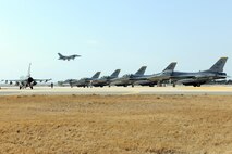 KUNSAN AIR BASE, Republic of Korea -- F-16D Fighting Falcons from the 80th Fighter Squadron and 38th Fighter Group prepare for takeoff here March 9 as part of an exercise called, "Buddy Wing." This exercise a combined fighter exchange program designed to improve interoperability between the U.S. Air Force and ROK Air Force fighter squadrons. It facilitates fighter pilots and maintenace personnel to exchange tactics and procedures for the betterment and safety of the peninsula. (U.S. Air Force photo by Tech. Sgt. Jonathan Pomeroy)