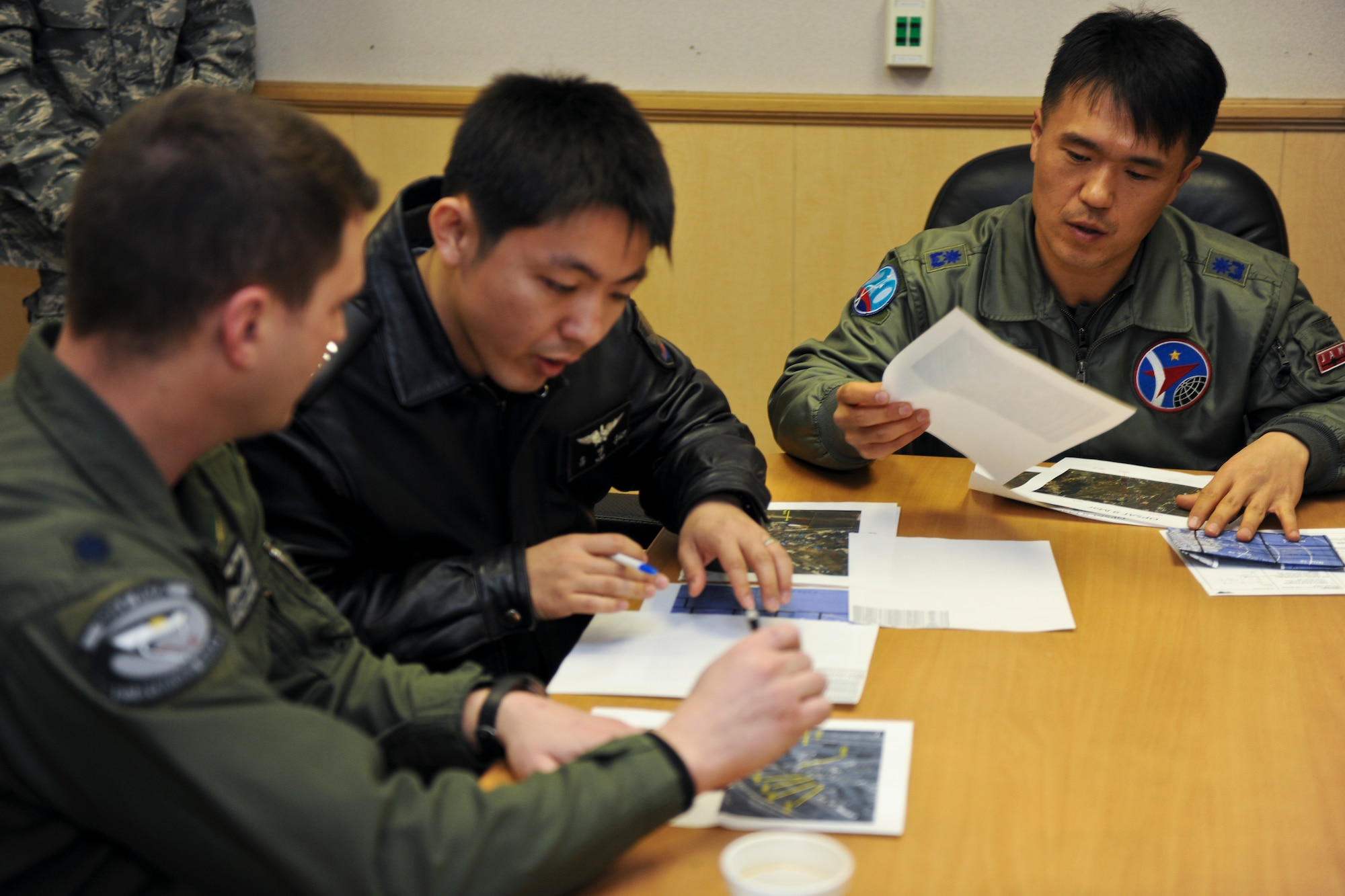 KUNSAN AIR BASE, Republic of Korea -- U.S. Air Force and ROK Air Force leaders exchange tactics and procedures for the betterment and safety of the peninsula here March 9. This knowledge exchange is part of an exercise called, "Buddy Wing", which is a combined fighter exchange program designed to improve interoperability between the U.S. Air Force and ROK Air Force fighter squadrons. (U.S. Air Force photo by Tech. Sgt. Jonathan Pomeroy)