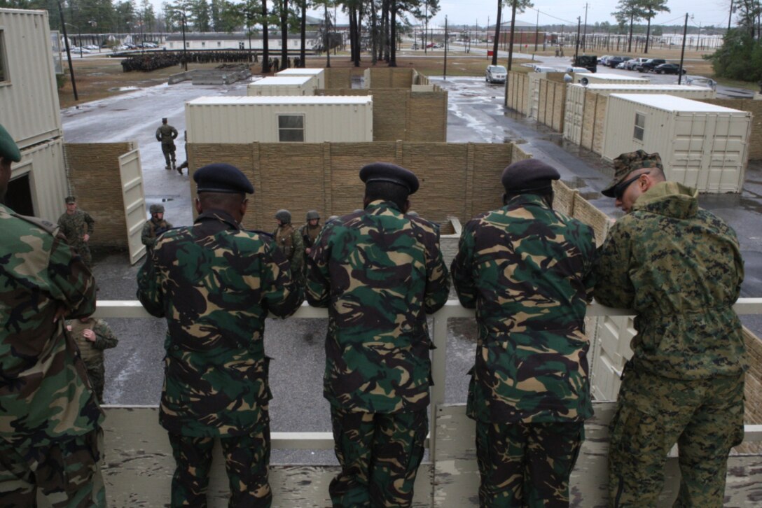 Military dignitaries from Rwanda, Tanzania and Uganda observe Infantry Training Battalion students conduct military operations on urban terrain aboard Camp Geiger, March 10. The dignitaries’ two-day visit to Marine Corps Base Camp Lejeune and satellite installations is part of a three-base amphibious familiarization tour, learning  amphibious assault techniques and observing various training exercises.