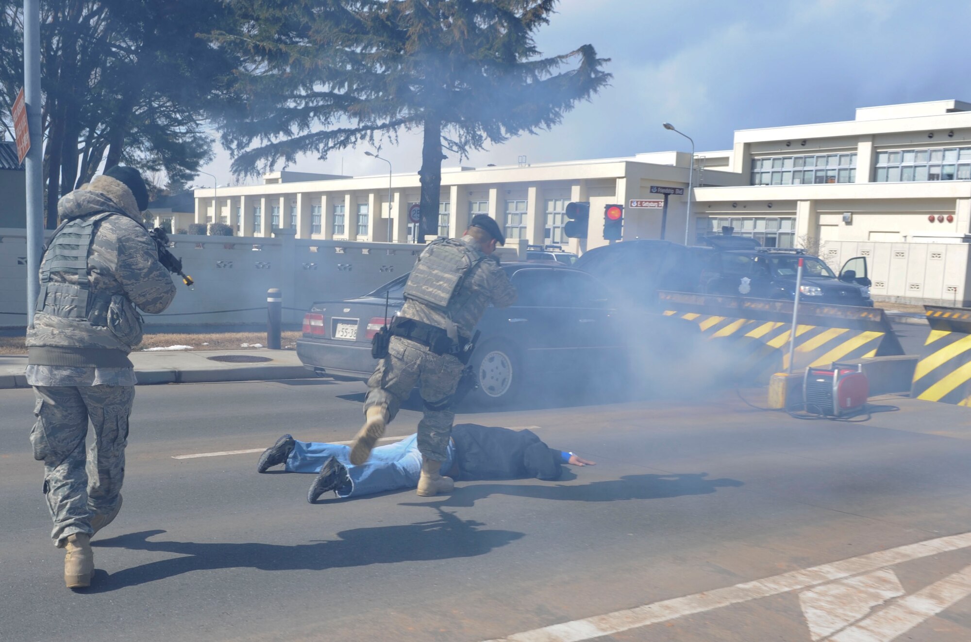 Two U.S. Air Force 35th Security Forces Squadron members take charge of a (simulated) gate runner during and exercise at Misawa Air Base, Japan, Mar. 10, 2011. Exercises allow the Airmen of the 35th Fighter Wing to demonstrate their ability to survive and operate in contingency situations.   (U.S. Air Force photo by Tech. Sgt. Russell McBride/Released)