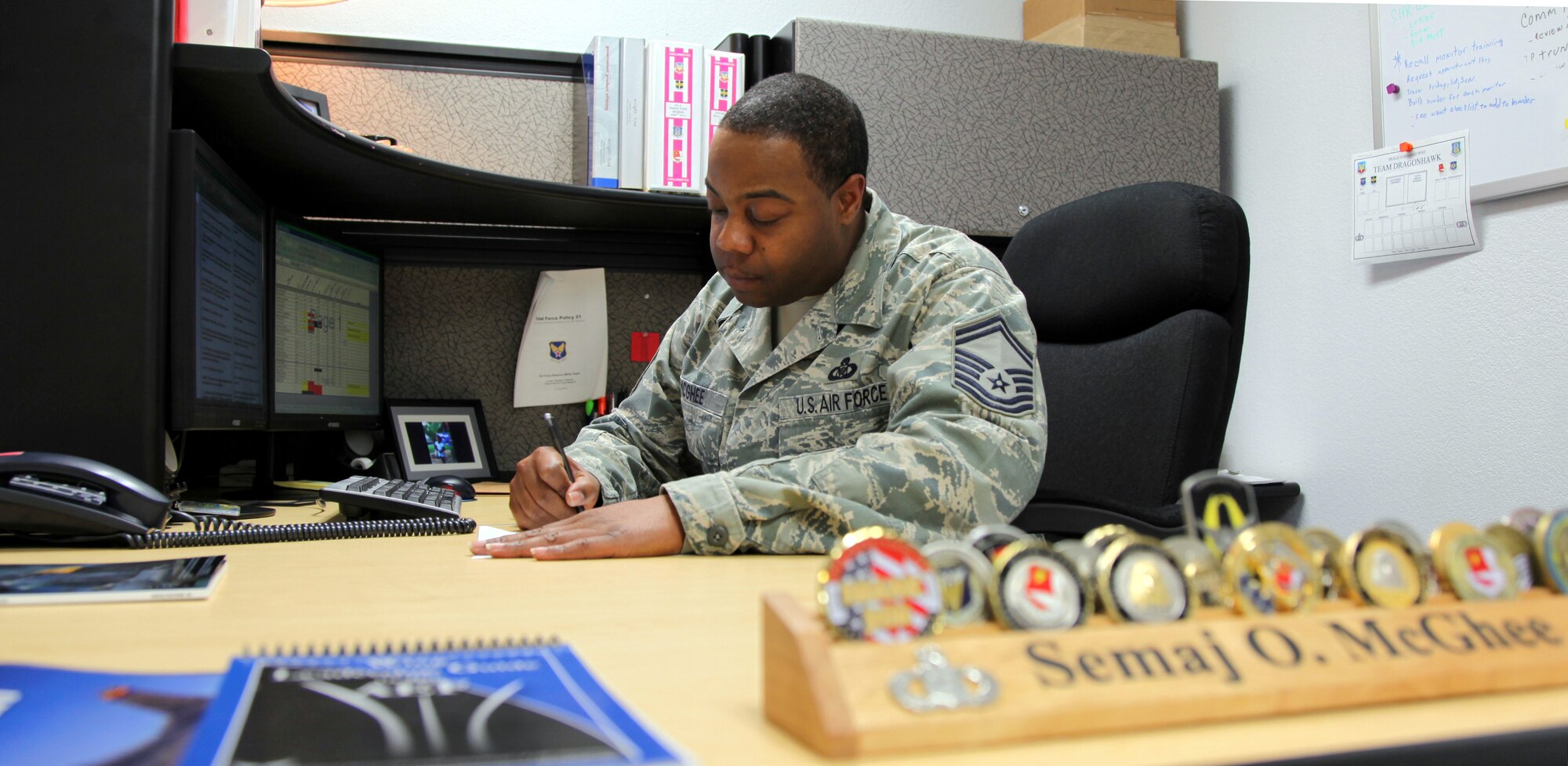 Senior Master Sgt. Semaj McGhee takes care of paperwork as superintendent of the Beale Command Post.  McGhee garnered Air Force Reserve Command recognition for his job performance, winning the 2010 Command Post Senior Non-commissioned Officer of the Year Award. (U.S. Air Force Photo/Tech. Sgt. Kenneth McCann)