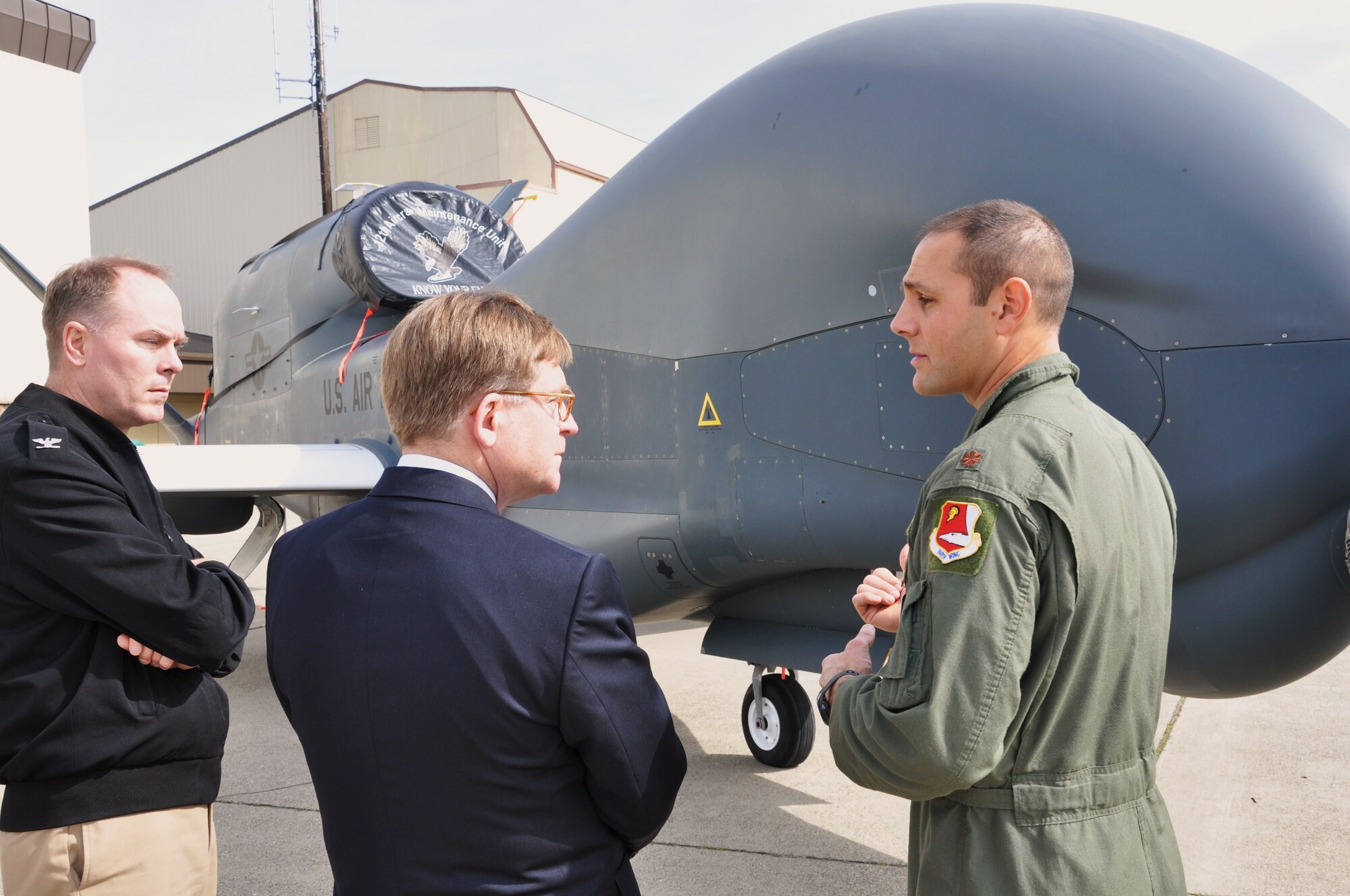Deputy Assistant Secretary of Defense for Reserve Affairs, Paul Patrick, and OASD Deputy Director of Intelligence and Information Operations, Capt. Bernie Upchurch, are briefed on the capabilities of the Global Hawk by a 13th Reconnaissance pilot during their visit to Beale Air Force Base, Calif., Mar. 9, 2011. Patrick, Upchurch, and Col. Scott Sauter, OASD Deputy Director for Training Program Management, spent the day touring the 940th Wing's operational squadrons to learn first-hand about the diversity of missions that comprise the Reserve unit and how members work side-by-side with active duty counterparts in one of the Air Force's top total force initiative efforts. (U.S. Air Force photo/Dana Lineback)