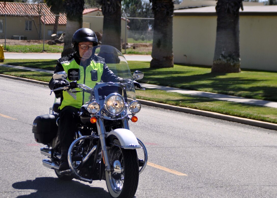 Maj. Gen. Eric W. Crabtree, commander, 4th Air Force, departs from the 4th Air Force Headquarters building parking lot at the beginning of a farewell ride at March Air Reserve Base, Calif., March 9, 2011.  Members of 4th Air Force organized the ride as a way to say goodbye to General Crabtree, who will be taking a new assignment at the Defense Threat Reduction Agency, Ft. Belvoir, Va. 