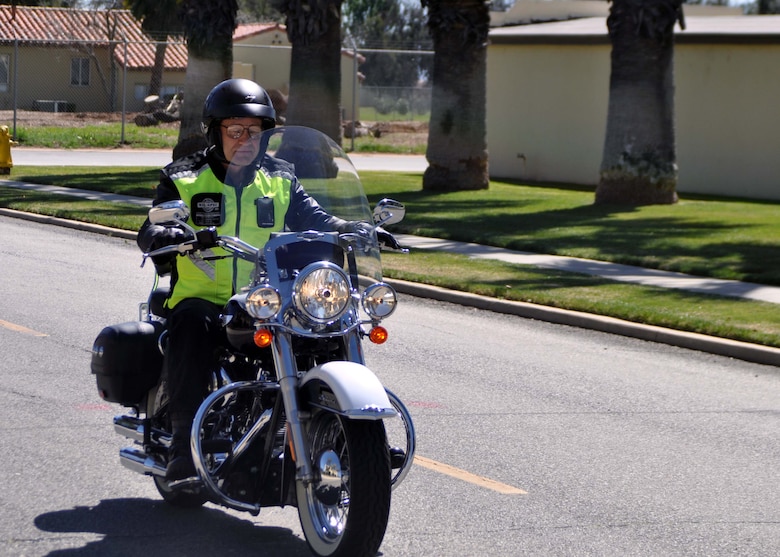 Maj. Gen. Eric W. Crabtree, commander, 4th Air Force, departs from the 4th Air Force Headquarters building parking lot at the beginning of a farewell ride at March Air Reserve Base, Calif., March 9, 2011.  Members of 4th Air Force organized the ride as a way to say goodbye to General Crabtree, who will be taking a new assignment at the Defense Threat Reduction Agency, Ft. Belvoir, Va. 